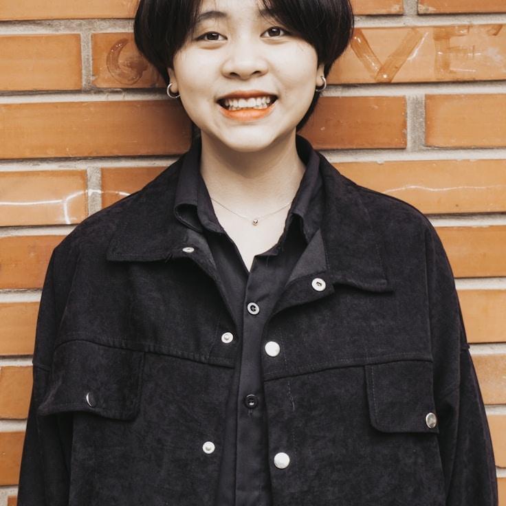 Kaveri Mehta, Lead Design Curator at Ledger Thread Service, reviewing corporate floral arrangements